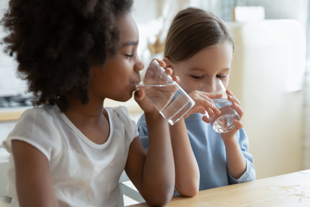 two children drinking water