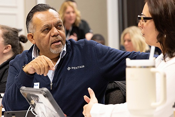 Pentair employee talking with a colleague