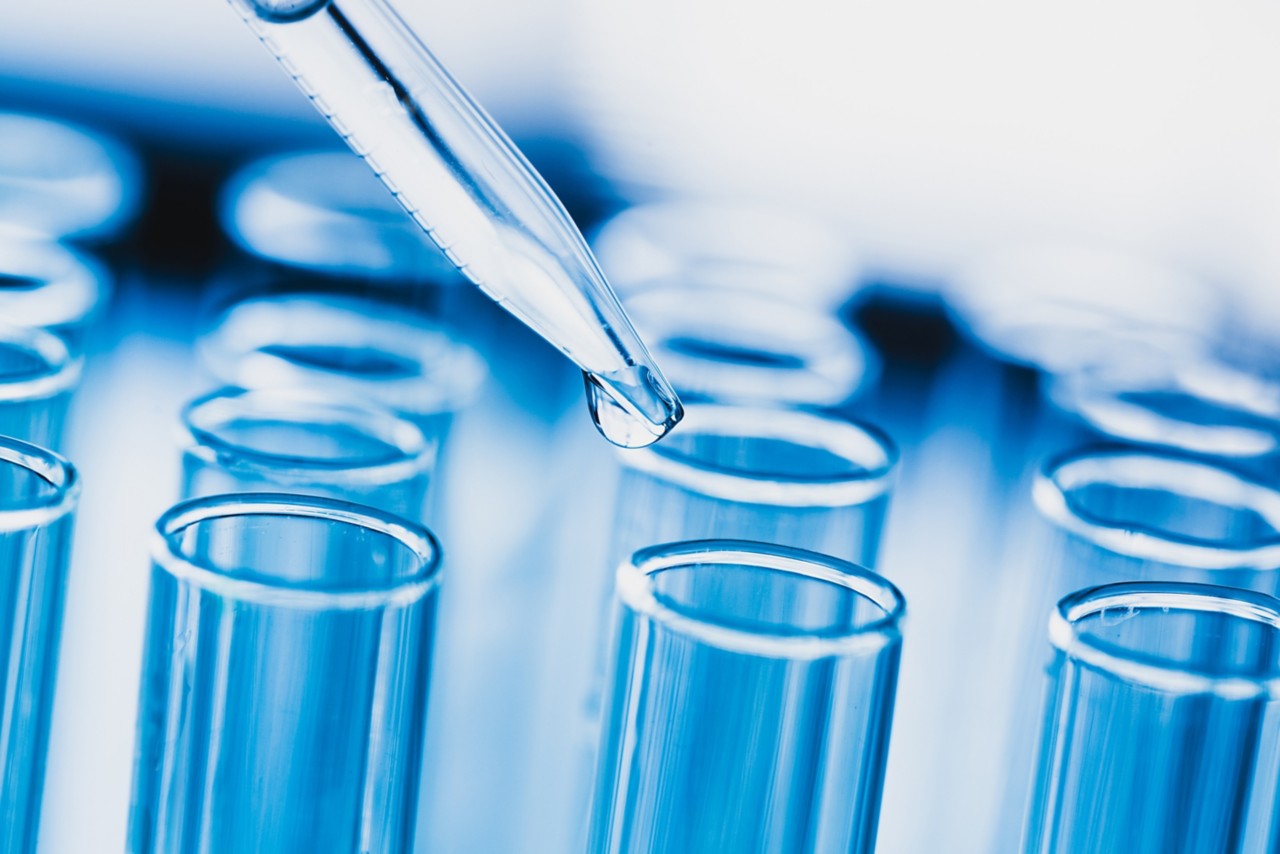 Blue test tubes with water droplet for research and testing