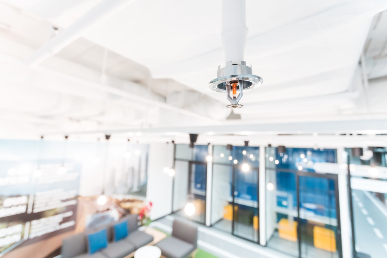 Fire Sprinkler in office building blur background, fire pumps, water supply, commercial pumps 