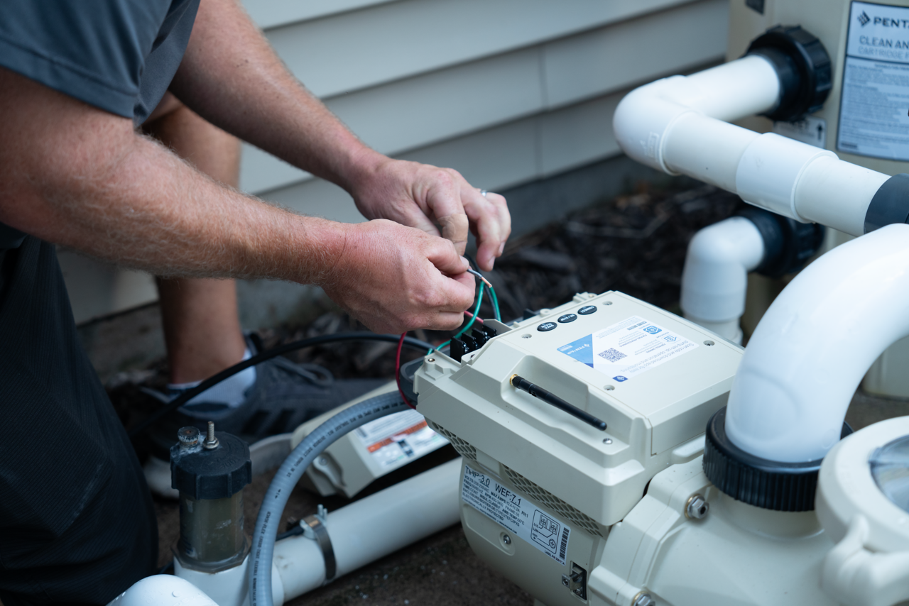 servicer installing intelliflo3 relay from Summer 2023 photoshoot in Ham Lake, MN 