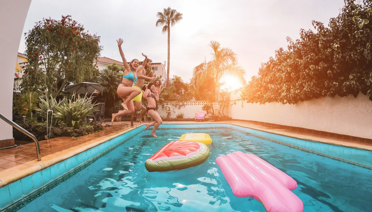 Backyard Pool with Floats and kids playing