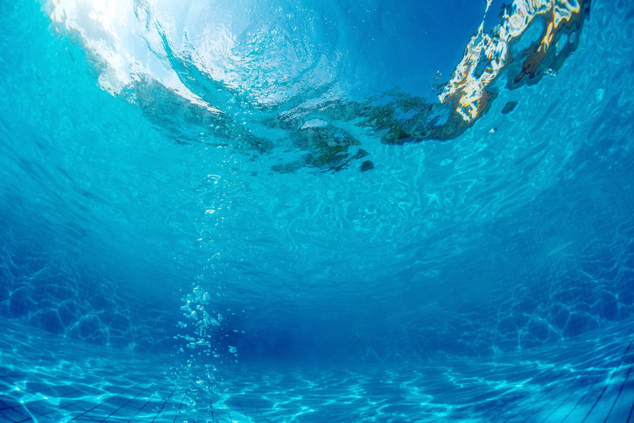 Underwater shot of the swimming pool with bubbles