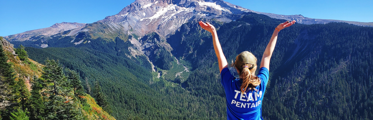 Team Pentair Employee Standing Near Mountain