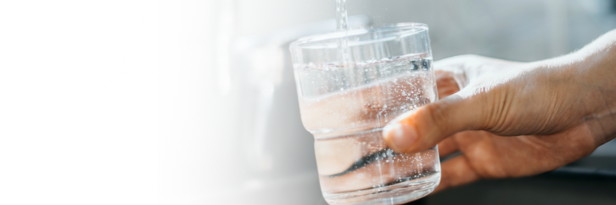 Cup over faucet getting drinking water